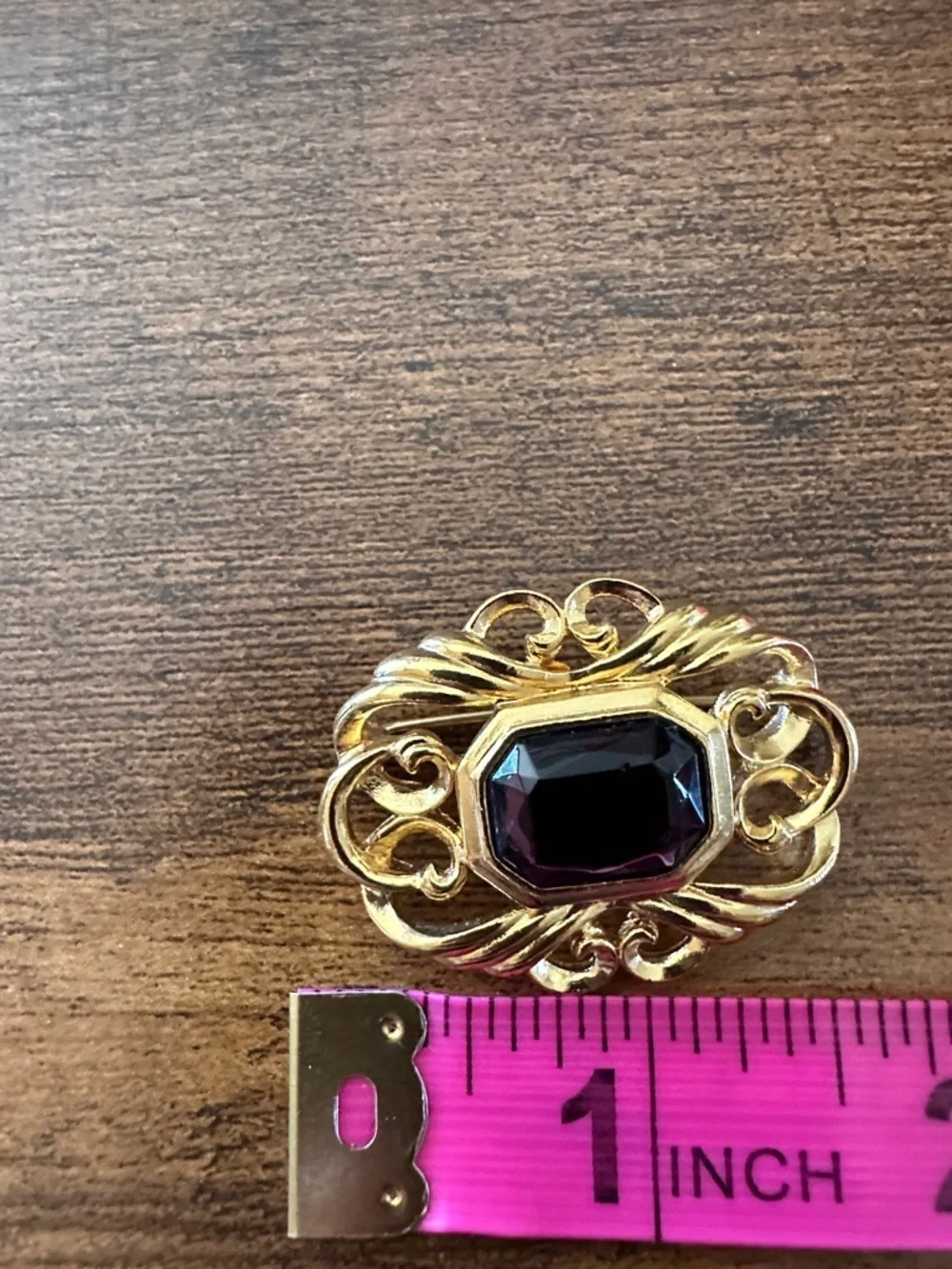 Gold-Tone Brooch with Deep Purple Center Stone